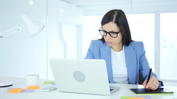 Designer working with Drawing tablet for a Computer