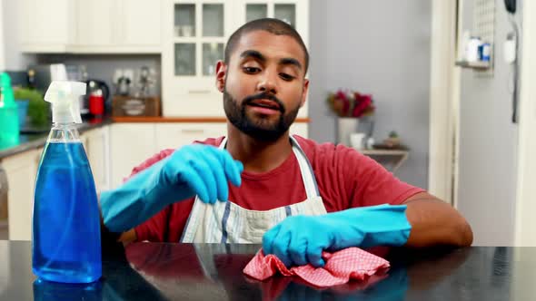 Man cleaning the kitchen worktop 4k