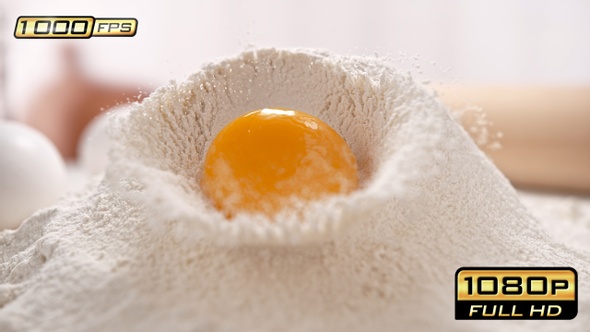 Egg Yolk Rolling Down the Pile of Flour