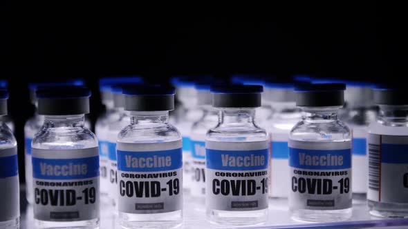 Glass vials for Covid-19 vaccine in laboratory. Group of Coronavirus vaccine bottles.