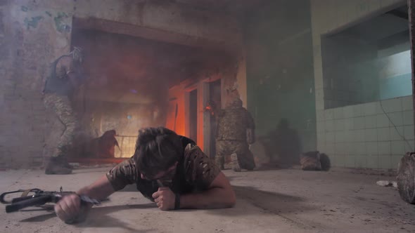 Brave Wounded Soldier Crawling Out From Fire Line