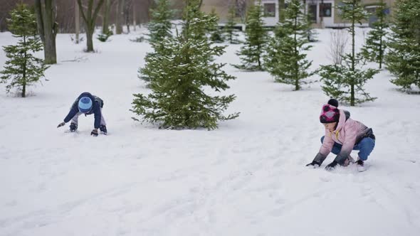 Children Play Snowball at Winter