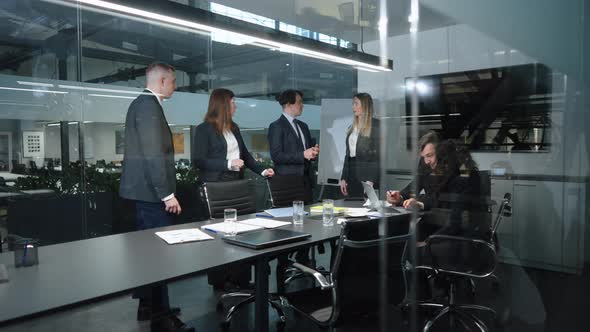 Participants of Business Conference Having Discussion in Office