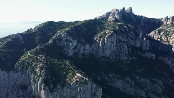 Drone flight over the famous mountain range of Catalonia; sunny winter