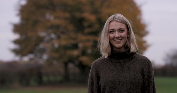 Portrait shot of a beautiful blonde woman smiling