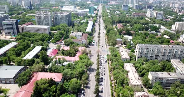 Top View of Almaty City. Green Streets, Big Clouds