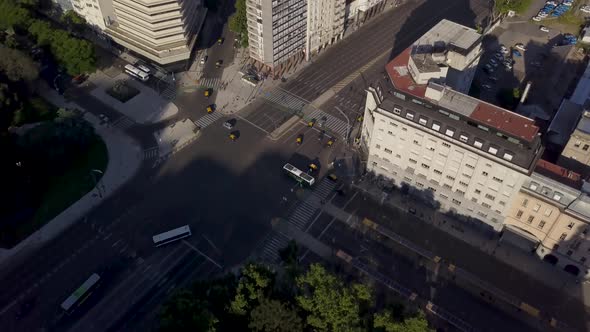 Aerial tilt reveal of two avenues crossing Buenos Aires city