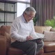 old senior asian retired couple enjoy talking conversation together on sofa - VideoHive Item for Sale
