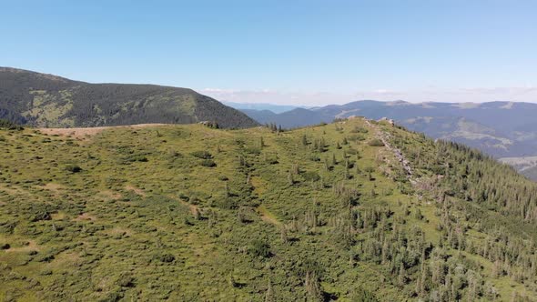 Aerial Panoramic View of Green Mountain Range and Hills in Valley of Carpathian