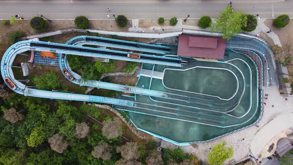 Boats Plunge Into The Water At An Amusement Park