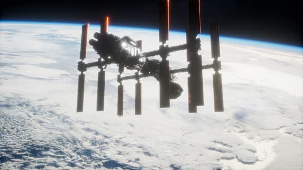 A View of the Earth and a Spaceship. ISS Is Orbiting the Earth alt