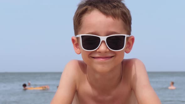 A Happy Child in Sunglasses