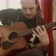 Musician with Dreadlocks Playing Guitar at Home - VideoHive Item for Sale