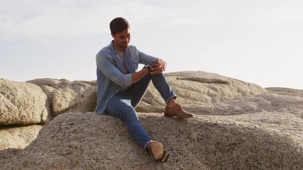 Young man looking at his phone