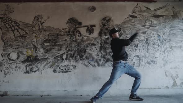 Modern dance in an old building - graffiti background