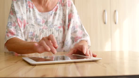 Senior woman using a digital tablet