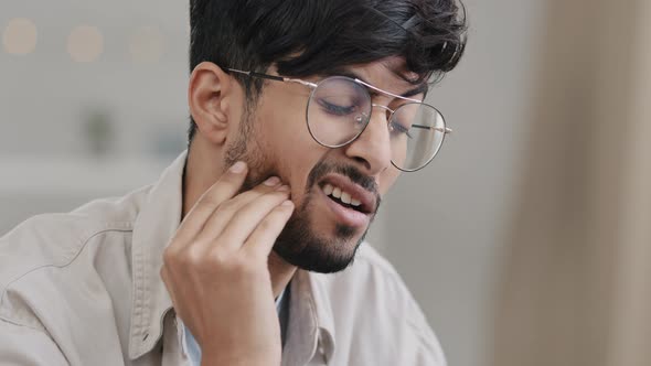 Closeup Male Sad Face Hispanic Arab Bearded Man with Glasses Suffering Guy Feels Toothache