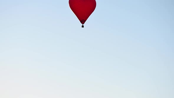 Colorful Hotair Heart Shape Balloon Flying on Sunset Over Blue Sky in Slow Motion Happy Valentines