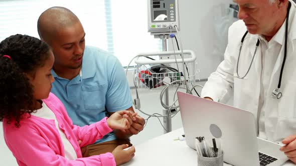 Male doctor checking patient blood pressure