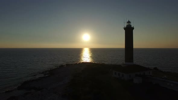 Sun setting in front of a lighthouse, Croatia