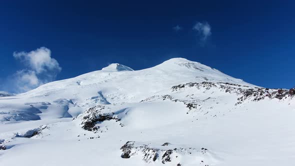 Stunning Aerial View of Mount Elbrus with Snowwhite Fields and Glaciers in Sunny Weather