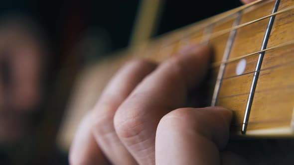 Professional Guitarist Plays Ballad on Brown Acoustic Guitar