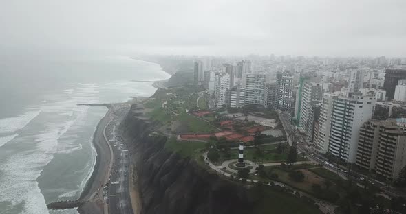 Drone shot of coastal city on a cloudy day in Latin America