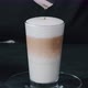 Barista pouring milk in hot coffee and making cappuccino foam in cafe close up, vertical - VideoHive Item for Sale