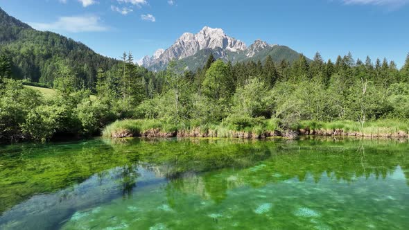 Flying over a nature park with mountains and a lake