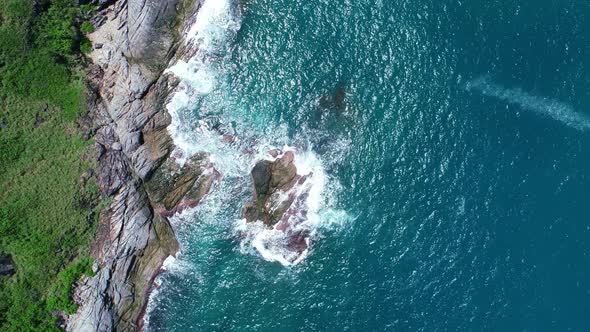 Aerial view Drone camera top down of seashore rocks in a blue ocean Beautiful sea surface