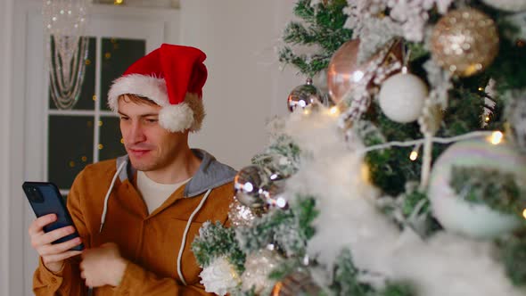 Man Using Smartphone During Christmas