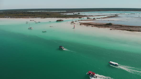 Mexican Speedboats Ships Resting in Shallow Ocean Water Aerial Shot