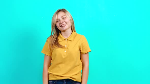 The Young Woman Smiles Beautifully As She Looks Into the Room