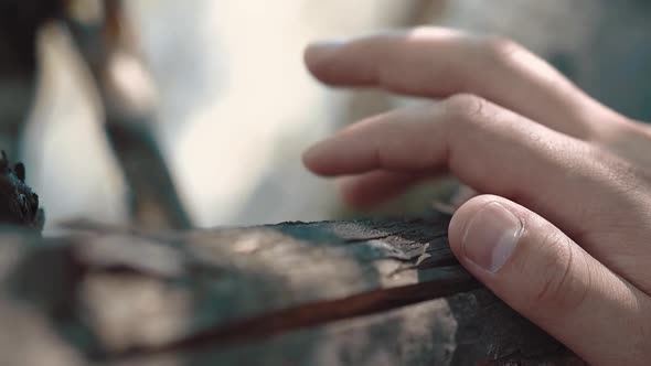 Young Man Nervously Knocks His Fingers on the Wooden Railing Closeup Slow Motion