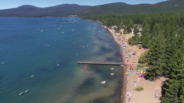 Emerald Bay Beach With Tourists On The Shore - Lake Tahoe CA - aerial drone shot