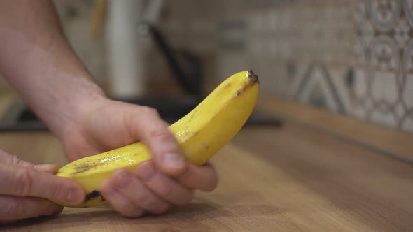 a Man Stroking a Banana