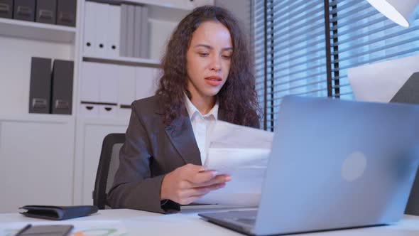 Depressed Latino business woman feel worried about financial problem.