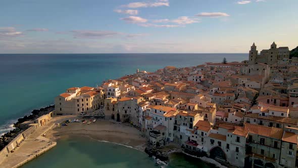 Cefalu Sicily Sunset at the Beach of Cefalu Sicilia Italy Mid Age Men and Woman on Vacation Sicily