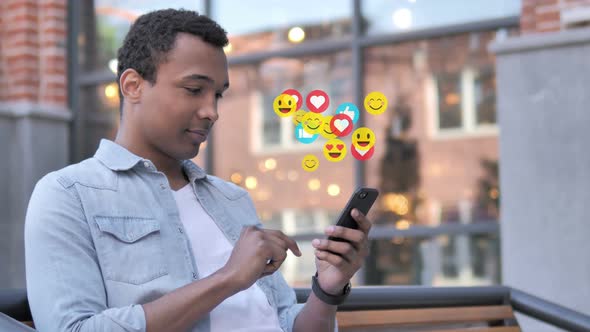 African Man Using Smartphone Emoji Comments and Likes