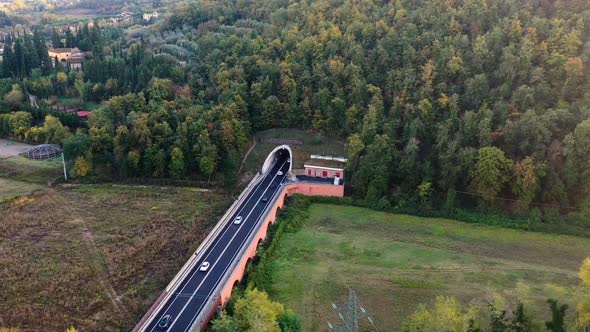 Aerial hyperlapse of entrance of a tunnel on mountain region. Italy.