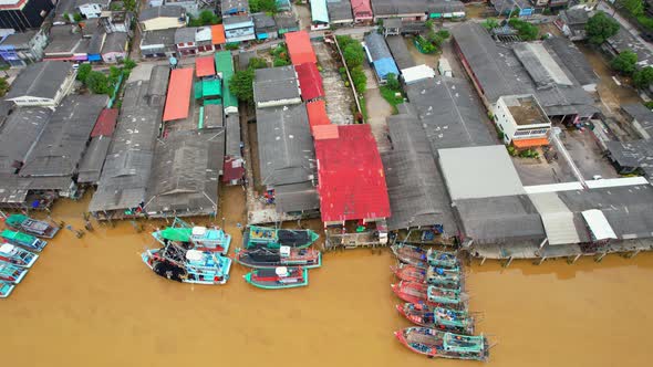 Aerial shot of river and local fisherman village beside the sea