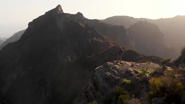 Man Hiker Standing on the Edge of a Cliff in the Mountains of Madeira Island, Portugal