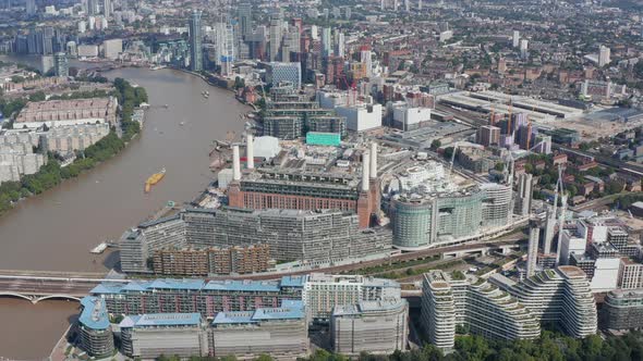 Slide and Pan Aerial Footage of Decommissioned Battersea Power Station and Surrounding Apartment