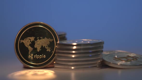 Popular Cryptocurrency Ripple XRP Rotate on the Table with Many Other Gold and Silver Digital Coins