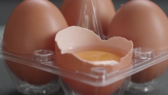 Lots Of Chicken Eggs And One Egg Open Are In The Storage Box Rotating