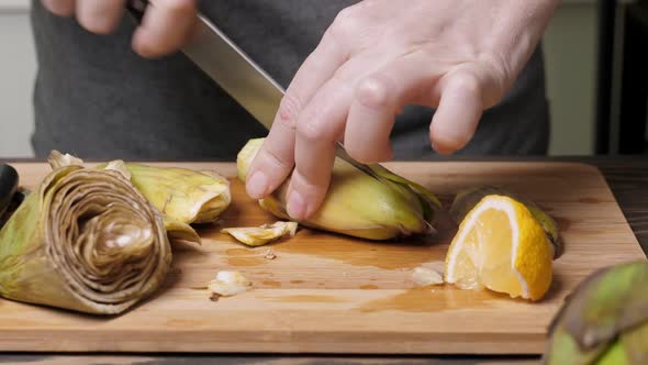 Woman Cut Artichoke