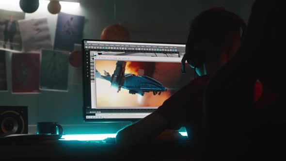 Teenager Creating 3D Cartoon on Computer