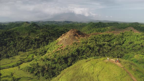 Aerial Tourist Hiking Hill Top Green Grass Mountain Peak with Traveler at Mountain Philippine Asia