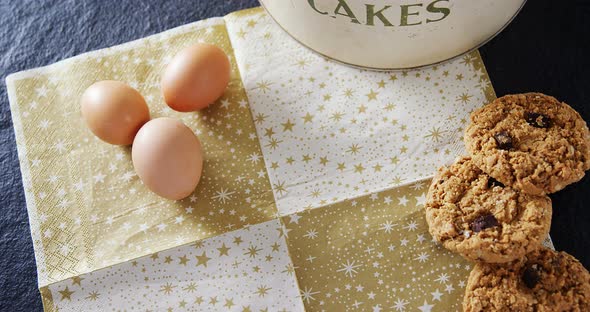 Brown eggs and cookies on a decoration paper 4k