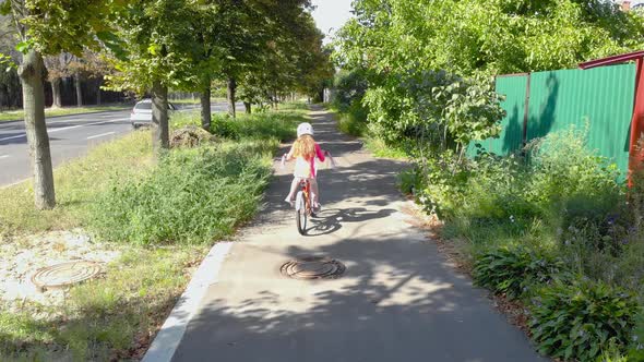 Little Girl On Bicycle